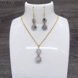 Parure dorée boucles d'oreilles et collier deux perles en pierre de quartz tourmaline et acier inoxydable