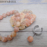 Parure femme bague large dorée et bracelet en pierre du soleil
