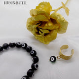 Bague ajustable dorée et bracelet en perles mauvais oeil noir et blanc