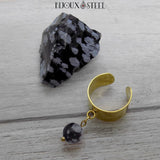 Bague dorée à perle pendante d'obsidienne flocon de neige