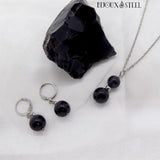 Boucles d'oreilles anneaux créoles et collier argenté en acier inoxydable et pierre d'obsidienne