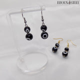 Boucles d'oreilles deux perles mauvais oeil noir et blanc