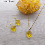 Boucles d'oreilles et collier coeurs jaunes en verre