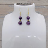 Boucles d'oreilles pendantes dorées deux perles de fluorite violette et acier