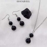 Boucles d'oreilles pendantes et colliers argentés deux perles en obsidienne noire et acier inoxydable