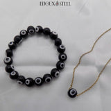 Bracelet 10mm et collier chaîne dorée à perles mauvais oeil noires et blanches