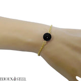 Bracelet en acier chirurgical doré et sa perle de tourmaline noire 10mm