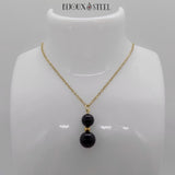 Pendentif deux perles en obsidienne et sa chaîne dorée en acier inoxydable