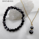 Collier à pendentif double perle doré et bracelet en perles de mauvais oeil noir et blanc