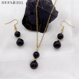 Collier à pendentif et boucles d'oreilles dorés doubles perles d'obsidienne noire