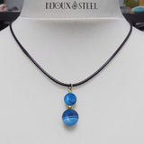 Collier cordon noir à pendentif deux perles d'agate bleue