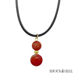 Collier cordon noir à pendentif doré deux perles d'agate rouge 