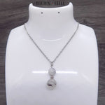 Collier deux perles en quartz à inclusion de tourmaline noire et sa chaîne argentée en acier inoxydable