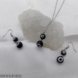Collier et boucles d'oreilles argentés deux perles mauvais oeil noir et blanc en acrylique et acier inoxydable