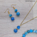 Collier et boucles d'oreilles dorés en perles d'agate bleue teintée et acier inoxydable