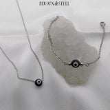 Collier et bracelet chaîne argentée à perle mauvais oeil noir et blanc en acier inoxydable et acrylique