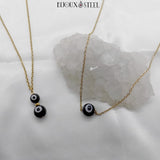 Colliers en acier inoxydable doré et perles mauvais oeil noires et blanches