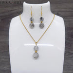 Parure dorée boucles d'oreilles et collier deux perles en pierre de quartz tourmaline et acier inoxydable