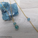 Parure dorée bracelet et collier à pendentif en pierre de fluorite bleue