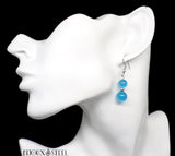 Boucles d'oreilles pendantes deux perles d'oeil de chat bleu en verre et acier inoxydable argenté