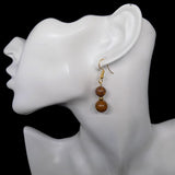 Boucles d'oreilles pendantes dorées deux perles en jaspe peau d'éléphant 