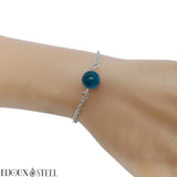 Bracelet en acier chirurgical argenté et sa perle d'apatite bleue 10mm