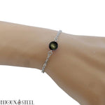 Bracelet en acier inoxydable argenté et sa perle d'obsidienne dorée 8mm