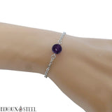 Bracelet en acier chirurgical argenté et sa perle de fluorine violette 8mm