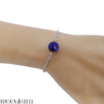 Bracelet à chaîne argentée en acier inoxydable et sa perle d'oeil de tigre bleu 10mm