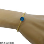 Bracelet en acier chirurgical doré et sa perle d'agate bleue teintée 8mm