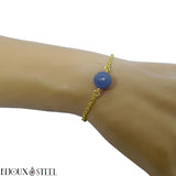 Bracelet en acier chirurgical doré et sa perle d'aventurine bleue 10mm