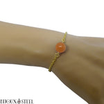 Bracelet en acier inoxydable doré et sa perle d'aventurine orange 10mm