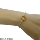 Bracelet en acier inoxydable doré et sa perle d'oeil de tigre caramel 10mm