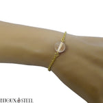 Bracelet en acier inoxydable doré et sa perle de cristal de roche 10mm
