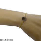 Bracelet doré en acier inoxydable et sa perle de quartz fumé 10mm