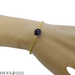 Bracelet en acier inoxydable doré et sa perle de gabbro merlinite 8mm